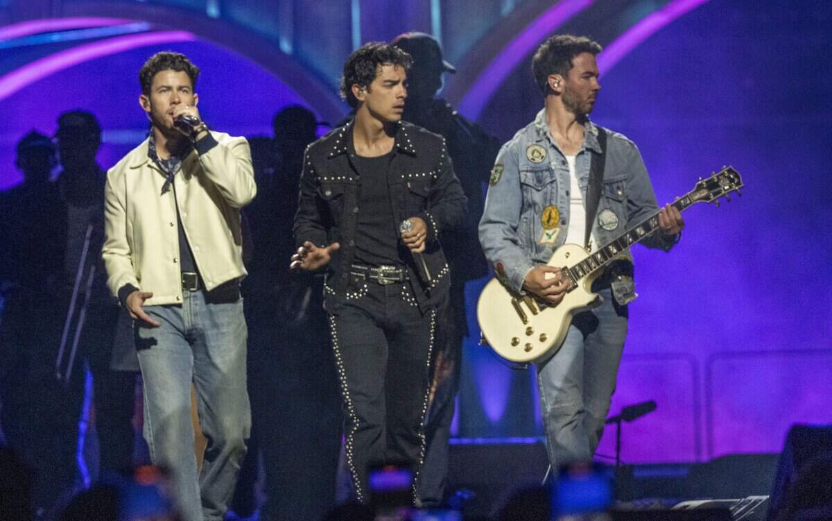 Nick, Joe and Kevin of the Jonas Brothers open their concert on Friday at Golden 1 Center.