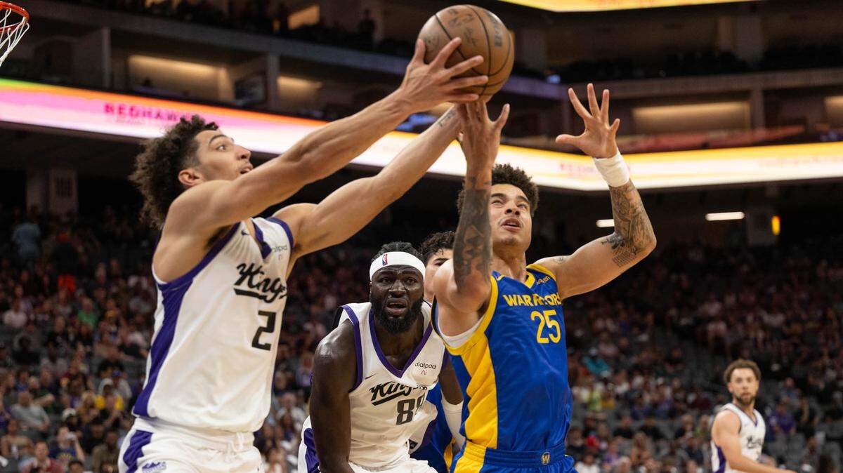 Sacramento Kings Colby Jones battles Golden State Warriors Lester Quinones for a rebound during the California Classic summer league at Golden 1 Center Monday, July 3, 2023 in Sacramento.