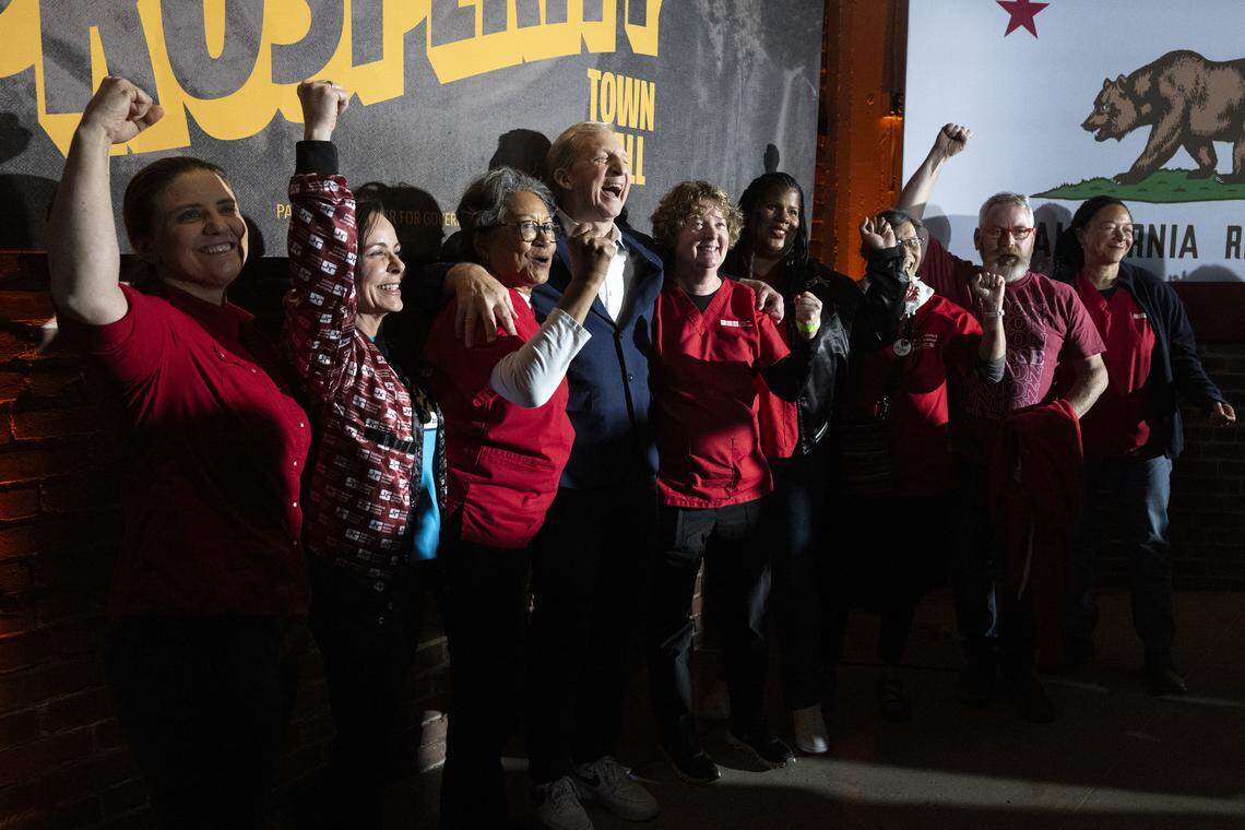 California Nurses Association members pose alongside Steyer at a Sacramento town hall last month. 