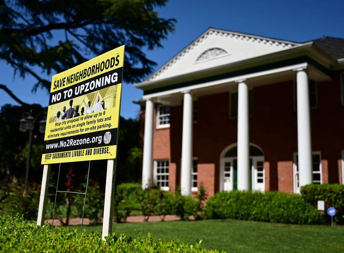 A sign stands in front of a home in Land Park in April 2021, opposing an “upzoning” proposal that was passed by the Sacramento City Council. Senate Bill 9, which passed later in the year, eliminated traditional single-family home zoning statewide, allowing higher density housing to be built on those parcels.