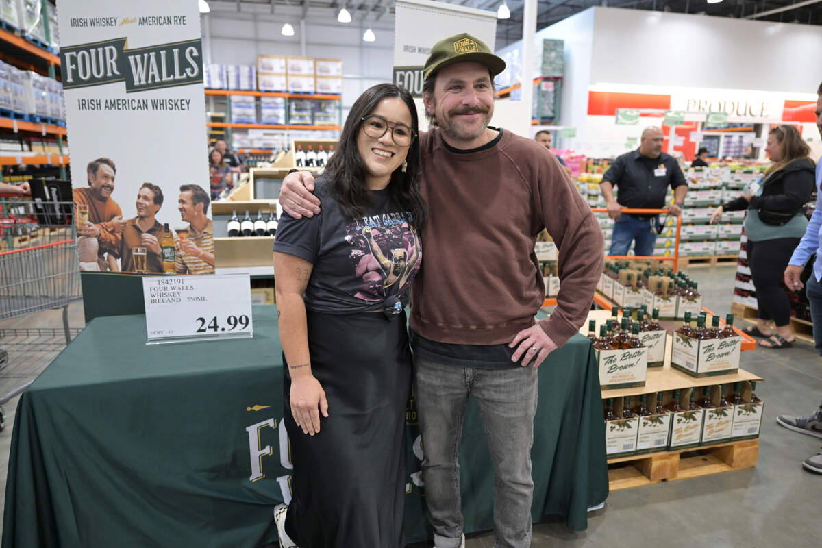 Katryna Remy, of Citrus Heights, poses for a photo with TV star Charlie Day at the grand opening of Costco in Loomis on Thursday. Remy was first in line to meet Day, who starred in the FX TV series “It’s Always Sunny in Philadelphia” and is one of the celebrities behind the Four Walls whiskey brand.