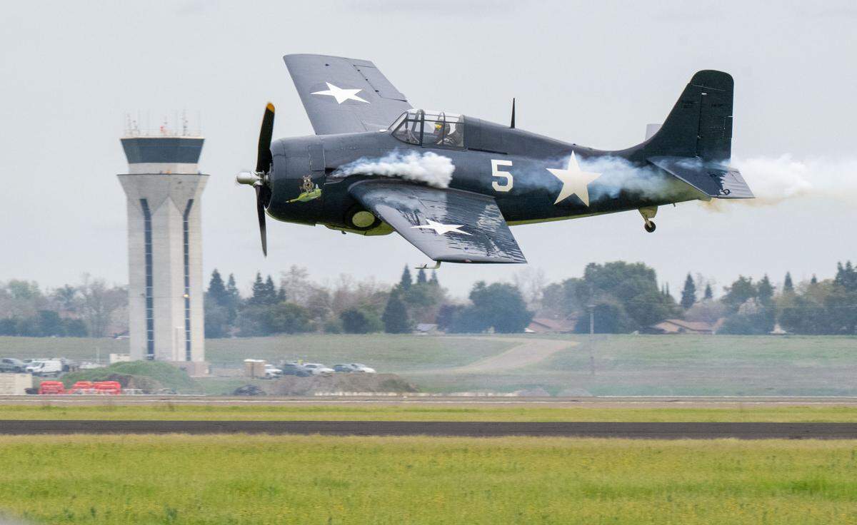 A World War II Grumman F4F Wildcat flies past the tower on a low pass at the California Capital Airshow at Mather Airport on Saturday, March 22, 2025.