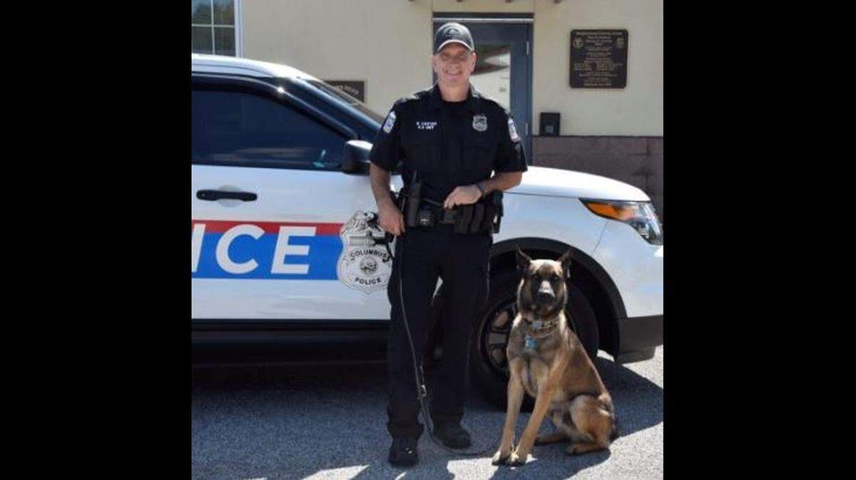 Officer Brian Carter of the Columbus, Ohio, police division shot Benzi, his K9 partner, Saturday after the Belgian Malinois attacked him during a training session, police say. Benzi was later euthanized.