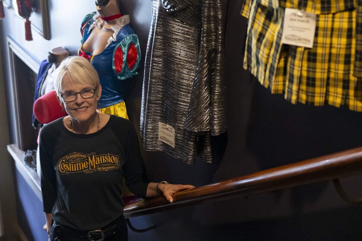 Evangeline’s Costume Mansion owner Deborah Chaussé poses for a portrait during the store’s grand reopening in Old Sacramento on Friday, June 26, 2026. The store was closed for just over a year due to fire damage.