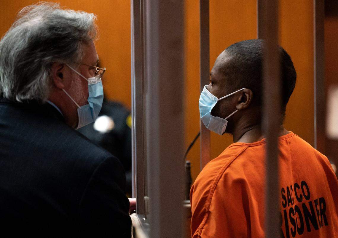 Public defender Norm Dawson speaks with suspect Mikilo Rawls, 37, during his arraignment in February at Sacramento Superior Court for the murder of Emma Roark. Roark’s body was found in the American River Parkway after she went missing from her Rancho Cordova home on Jan. 27.