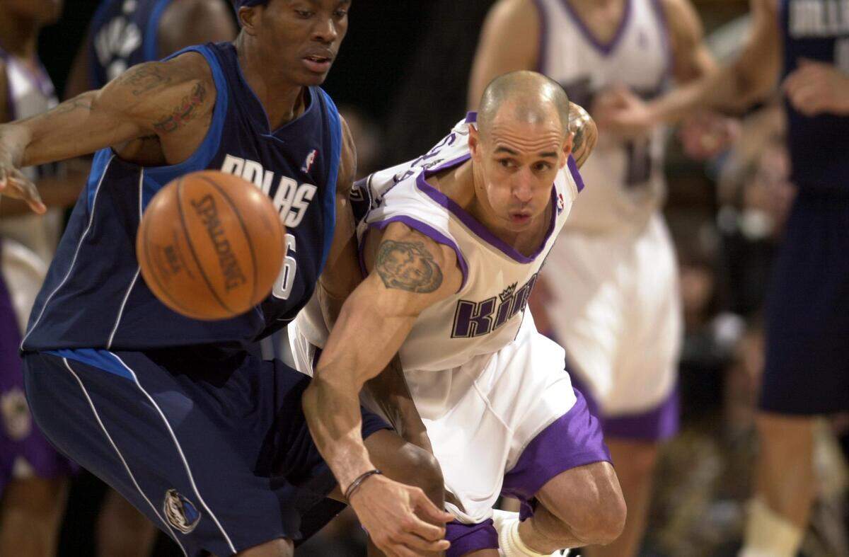 Kings guard Doug Christie steals the ball from the Marquis Daniels of the Dallas Mavericks at Arco Arena on March 11, 2004. Christie was an All-Defensive Team selection for all four of his full seasons with Sacramento.