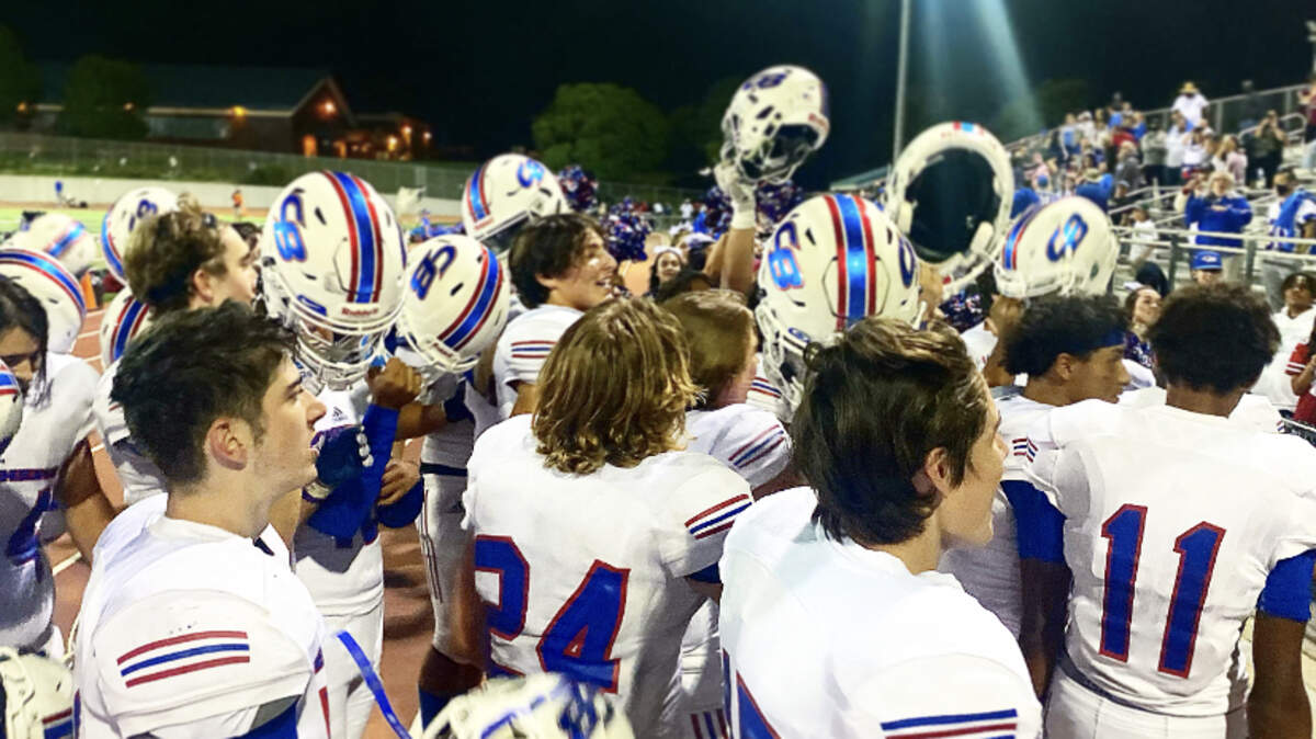 Christian Brothers players celebrate with their fans after beating Sheldon in September.