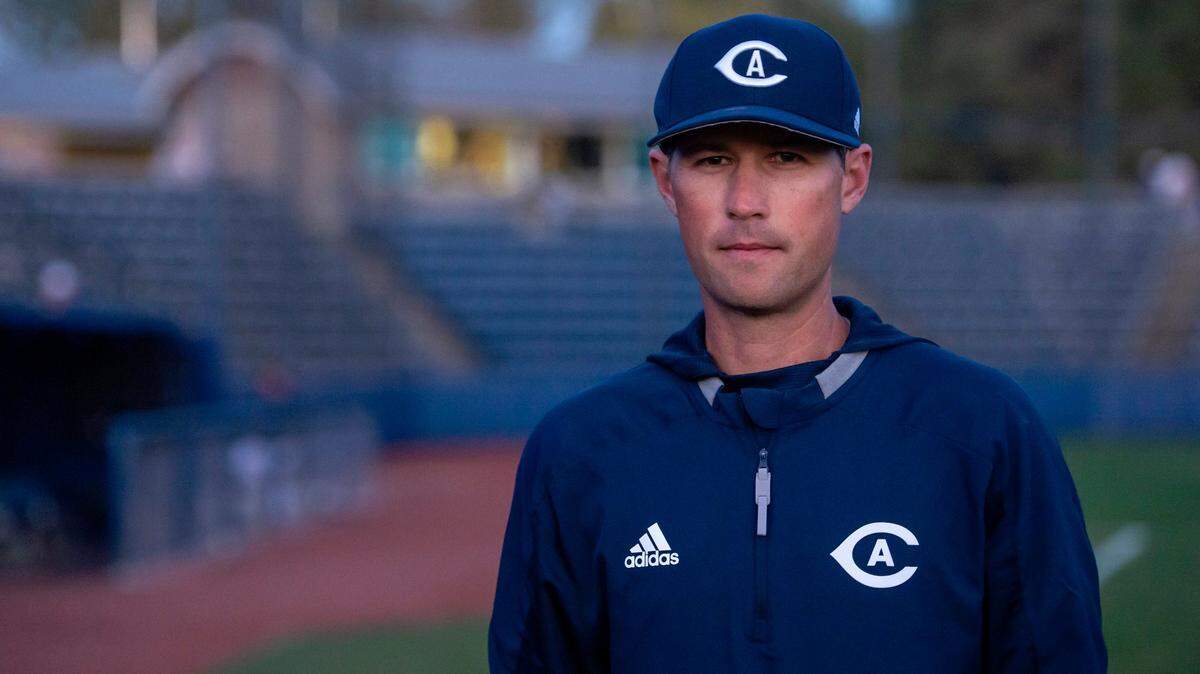 UC Davis head coach Tommy Nicholson poses for a photo at the home opener against St. Mary’s on Friday, Feb. 18, 2022. The Aggies are struggling forward after a 2021 hazing scandal that cost the former head coach his job.