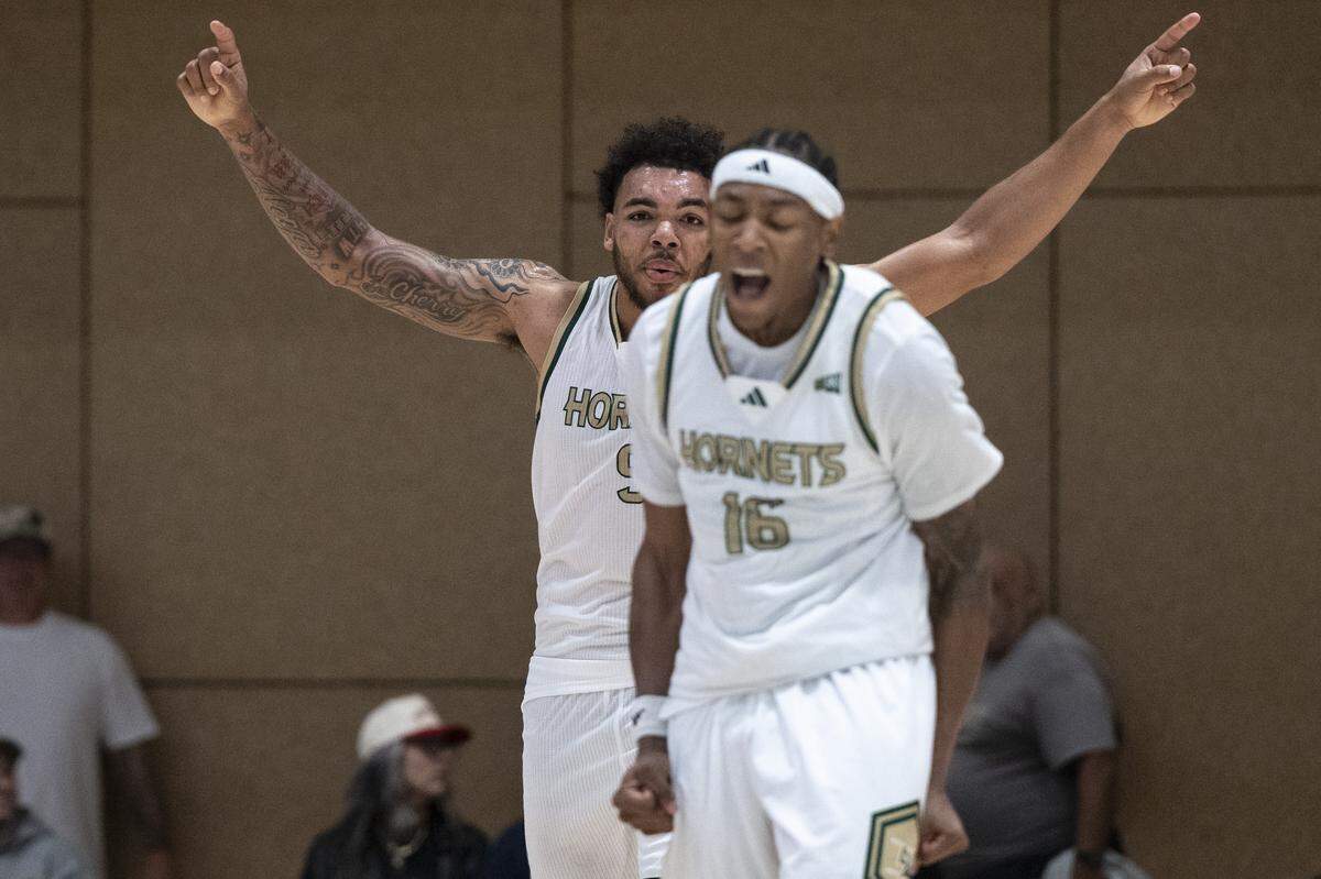 Sacramento State guard Prophet Johnson (16) and Sacramento State forward Jeremiah Cherry (9) react during a game between Sac State and Presbyterian at Hornet Pavilion in Sacramento on Sunday, Nov. 16, 2025.