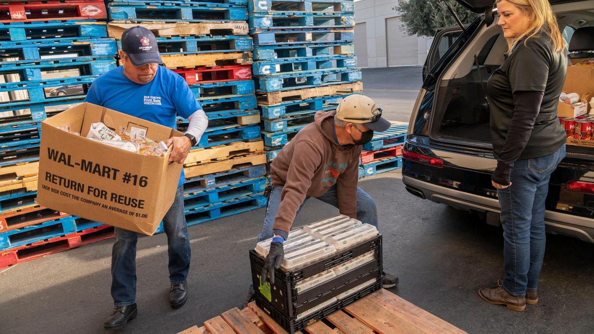 Volunteers weigh grocery items at the Elk Grove Food Bank in March 2020. Demand for food assistance in Elk Grove skyrocketed during the COVID-19 pandemic — more than 1.1 million meals were served by Elk Grove Food Bank Services in 2020.
