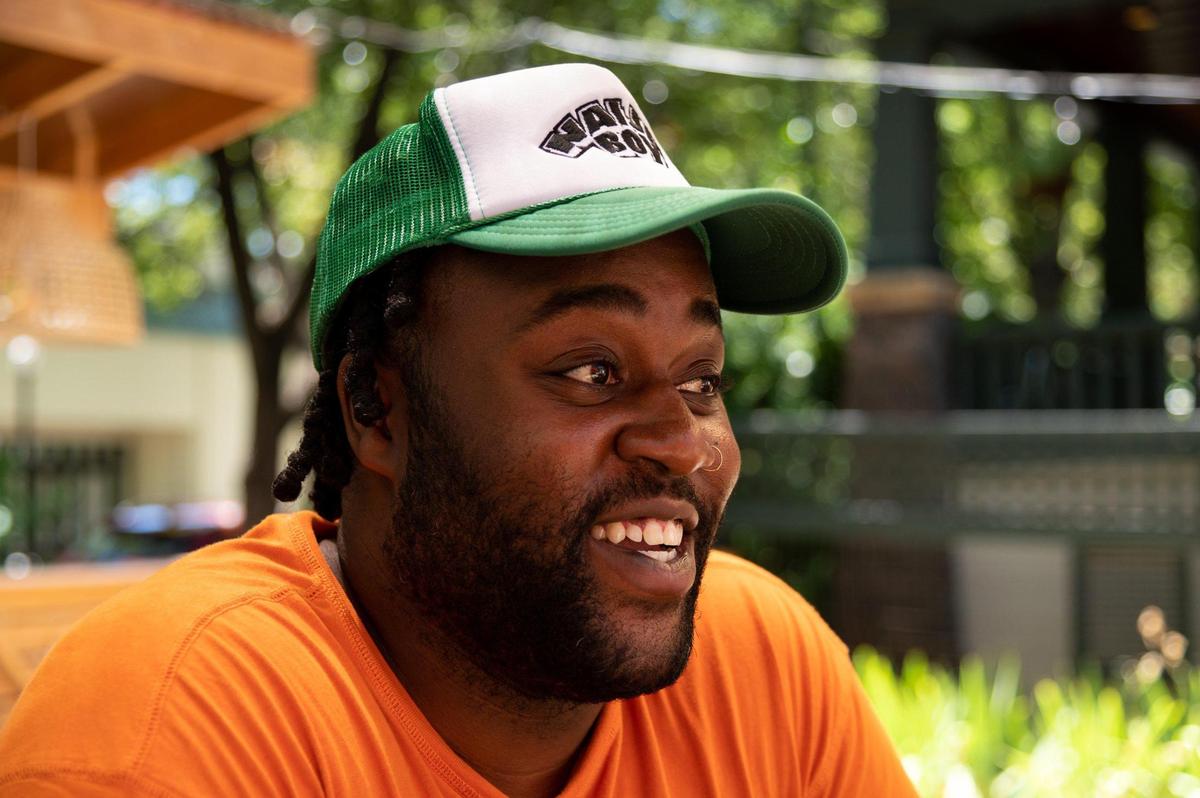 Rasheed Amedu sits on the outdoor patio at Naija Boy in Sacramento on July 6. A former Urban Roots Brewery & Smokehouse sous chef, Amedu will deploy familiar Mexican dishes like tacos and tostadas as vessels for Nigerian dishes new to many customers.