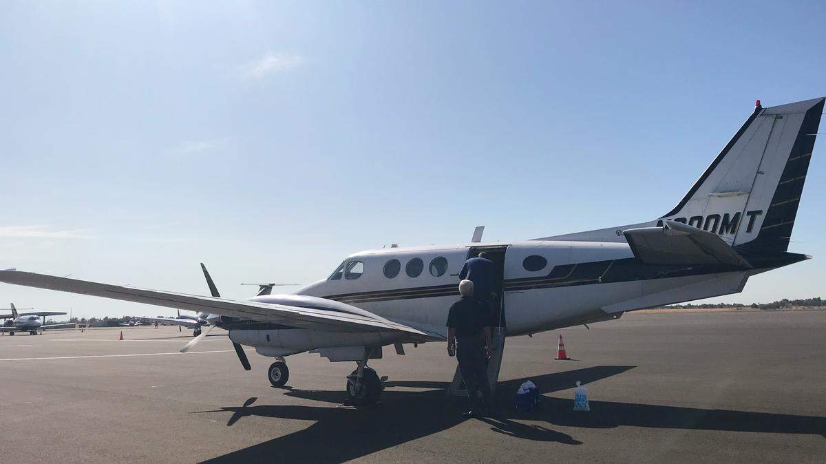 Business executives board the plane that flew the test flight from Mather Airport to San Jose International Airport.