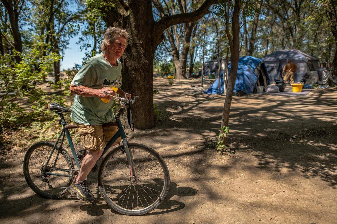 Arnold Hoblet, 55, says he’s lived at the camp near Discovery Park along the Sacramento River for 30 years.