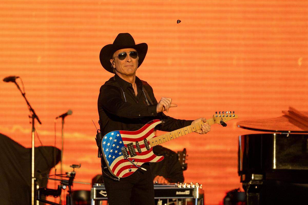 Clint Black throws his pick to audience during the GoldenSky Country Music Festival at Discovery Park in Sacramento on Friday, Oct. 18, 2024.