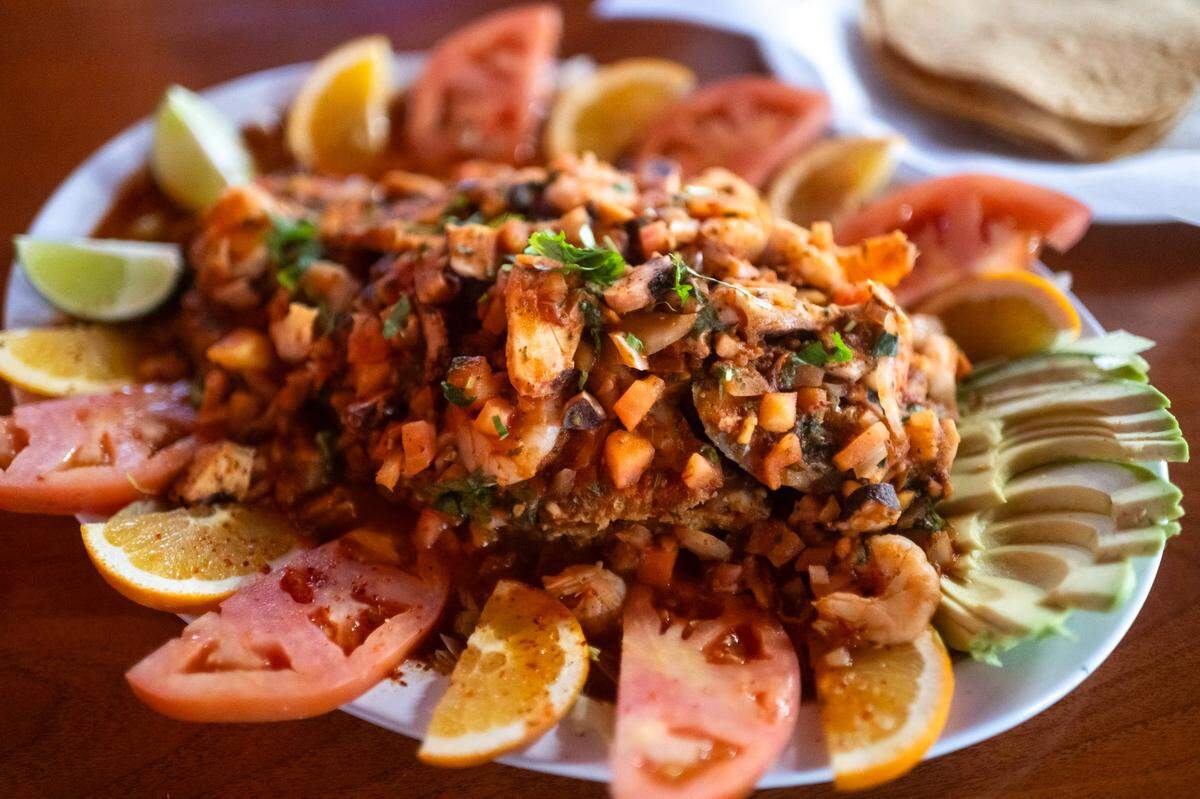 The mariscada – fried tilapia smothered in octopus, shrimp and salsa diabla – is ready to serve at El Parian Taqueria on Watt Avenue in North Highlands.