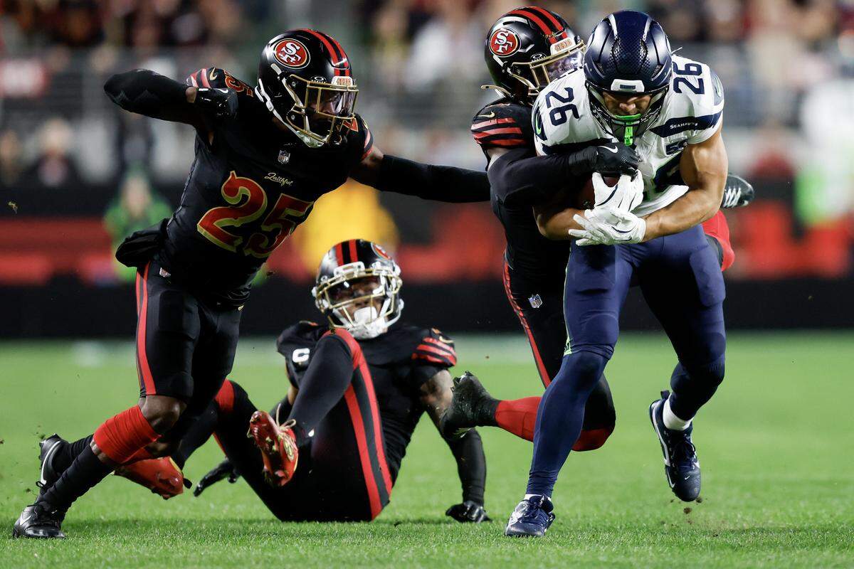 Zach Charbonnet of the Seattle Seahawks carries the ball against the San Francisco 49ers during the second quarter of a game at Levi's Stadium on Saturday in Santa Clara.