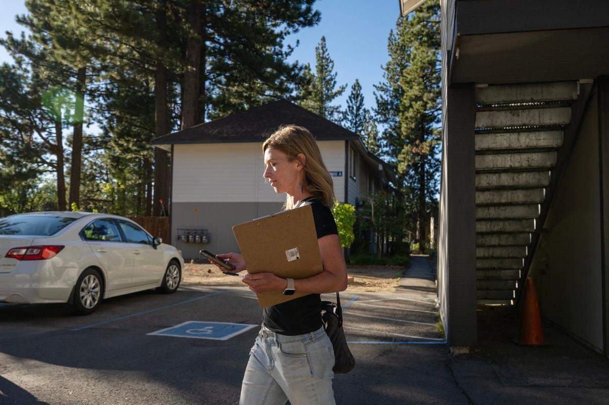 Measure N proponent Amelia Richmond knocks on doors in a South Lake Tahoe townhome complex in August. The November ballot measure would tax vacant property in in the city.