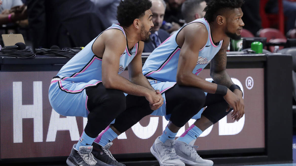 Miami’s Gabe Vincent, left, and forward Chris Silva wait to be substituted into the game during the second half of an NBA basketball game against the Orlando Magic on Jan. 27. Vincent grew up in Modesto and played high school ball in Stockton.