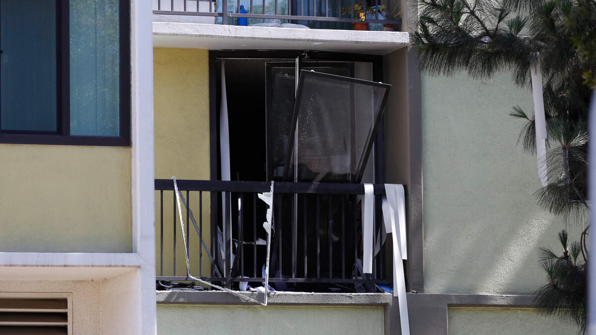A broken window at a retirement home at the scene of a fatal shooting in Long Beach, California., on Monday, June 25, 2018. A resident of a retirement home in Southern California opened fire on firefighters responding to a report of an explosion in the building, killing at least one and wounding others, officials said.