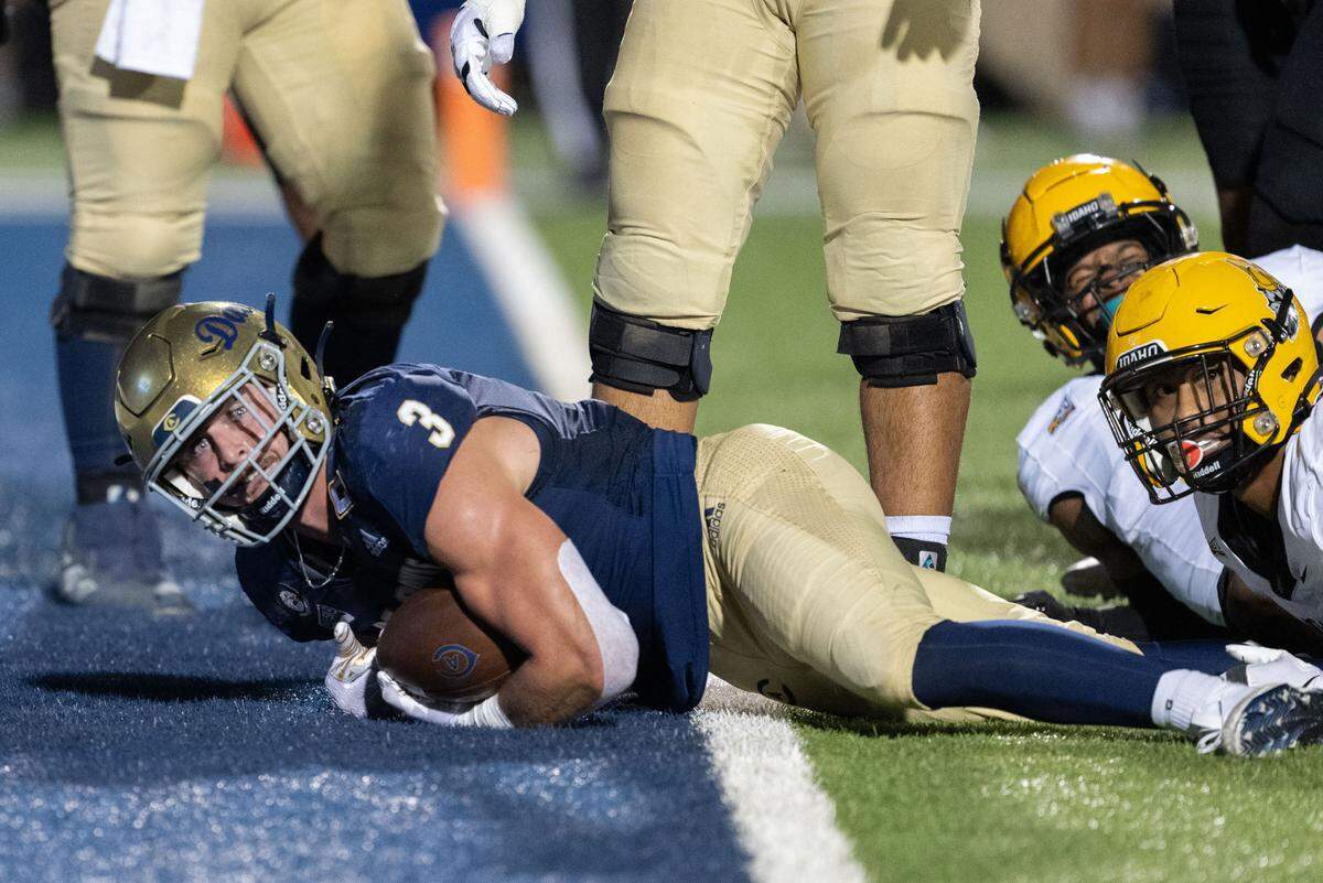 UC Davis Aggies running back Lan Larison (3) looks for a call as he goes into the end zone against Idaho Vandals on Saturday at UC Davis Health Stadium. Larison was called down before the goal line and scored on the next play.