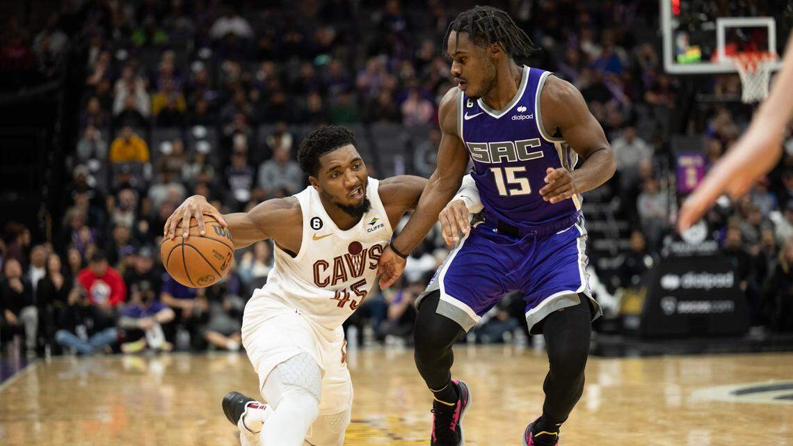 Sacramento Kings guard Davion Mitchell (15) pressures Cleveland Cavaliers guard Donovan Mitchell (45) in the second half during a game at the Golden 1 Center in Sacramento, Wednesday, Nov. 9, 2022.