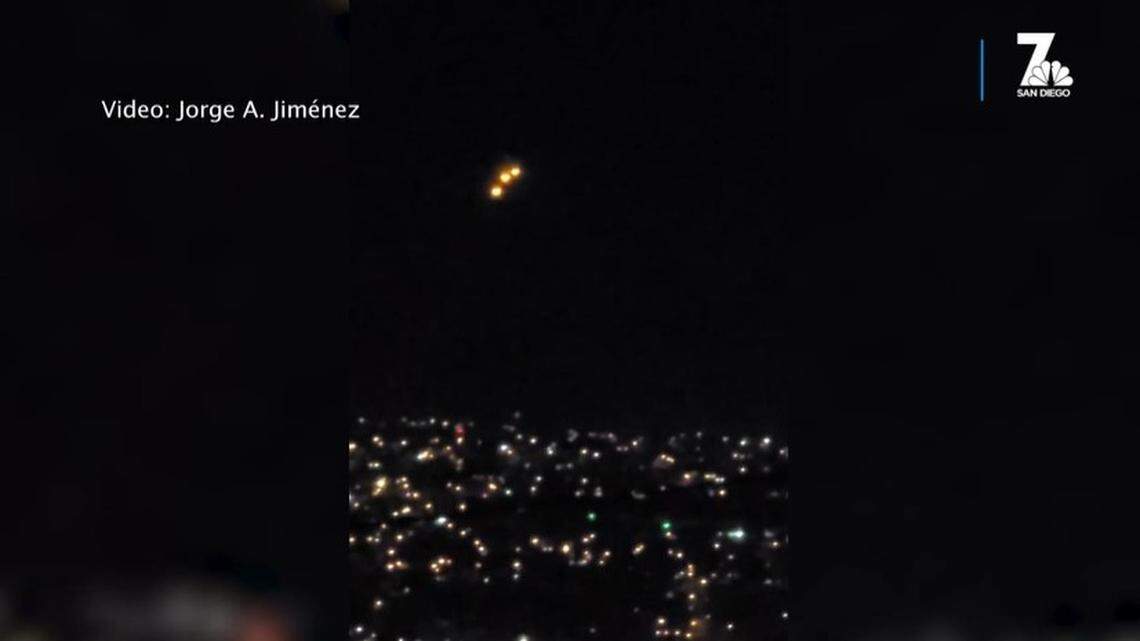 San Diego residents got photos and videos of mysterious glowing orbs in the night sky over the ocean, but there may be an explanation.