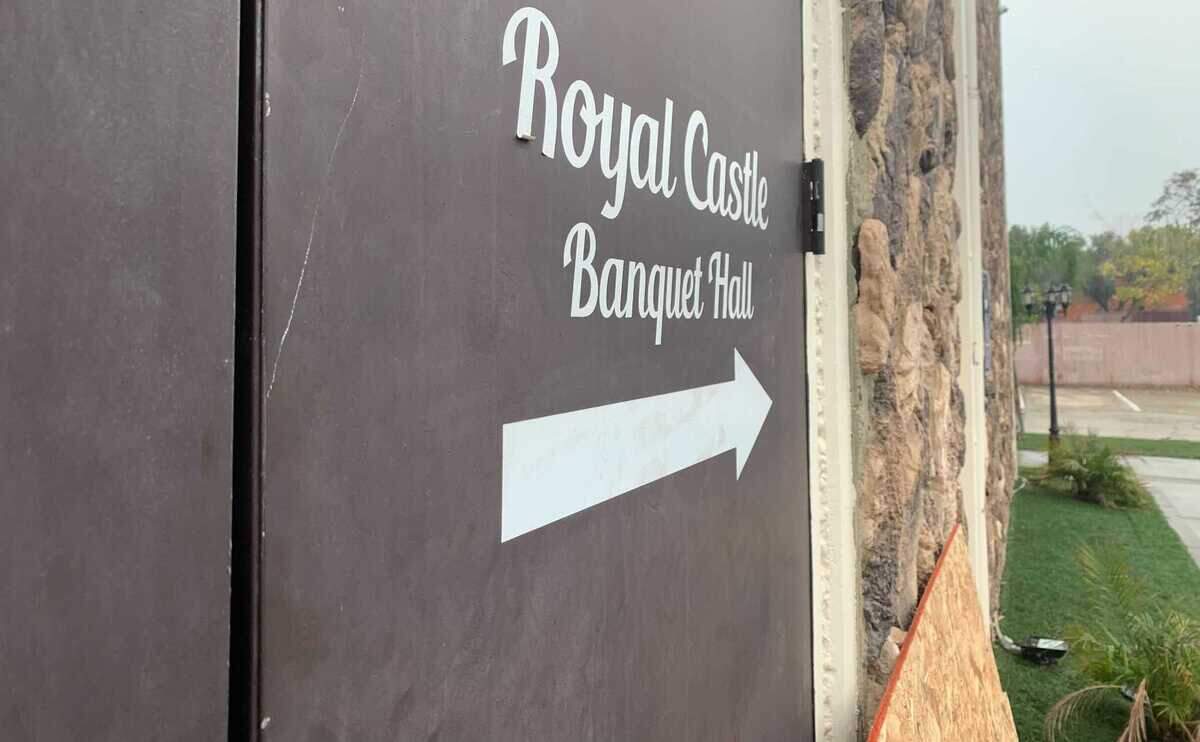 People created a makeshift memorial with candles, rose petals and other items outside the Royal Castle Banquet Hall, where two men were killed and five other people were injured in a shooting Saturday Oct. 30, 2021, during a large Halloween party in Sacramento County, California.