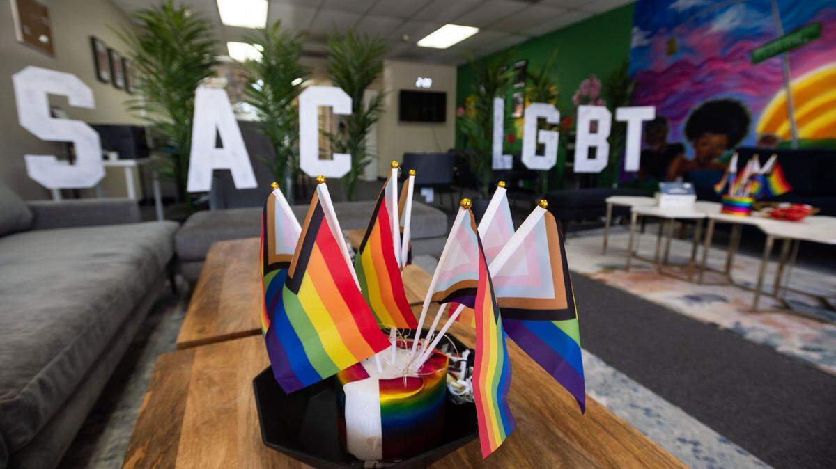 Miniature progress pride flags welcome visitors in the lobby of the Marsha P. Johnson Center South, the Sacramento LGBT Community Center's extension on Stockton Boulevard in south Sacramento in 2021. The center may cut mental health services if the City Council doesn't approve additional funding.