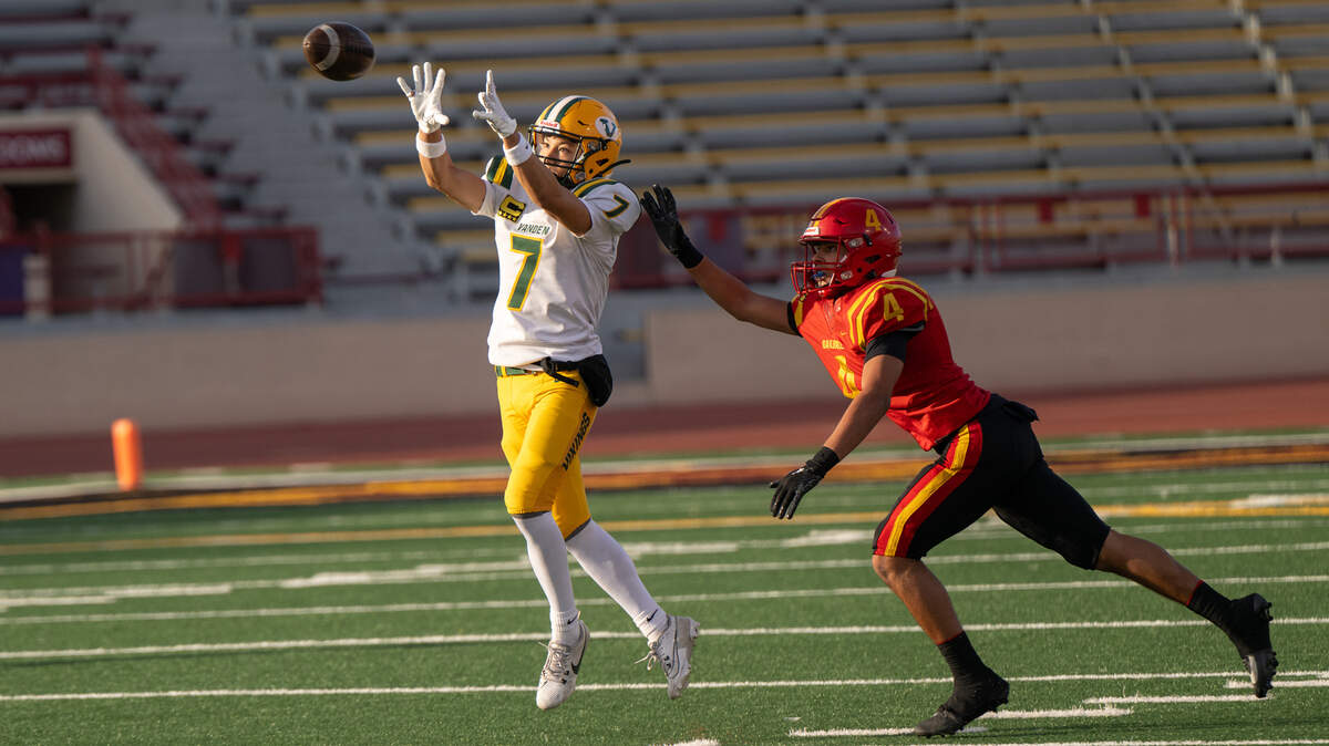 Vanden’s Logan Bailey makes a catch in front of coverage from Oakdale’s Gavin Wyatt in the Sac-Joaquin Section Division III championship game at Sacramento City College in Sacramento on Saturday, Nov. 30, 2024. Bailey finished the game with 14 catches for 235 yards and three touchdowns.