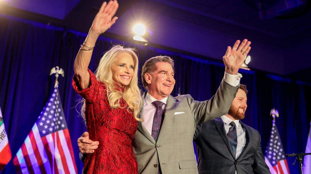 Steve Garvey and his wife Candace Garvey wave to supporters on election night in Palm Desert in March. Candace Garvey’s sister is a manager of Sisters in Christ, which has paid property taxes on the Garveys’ home.