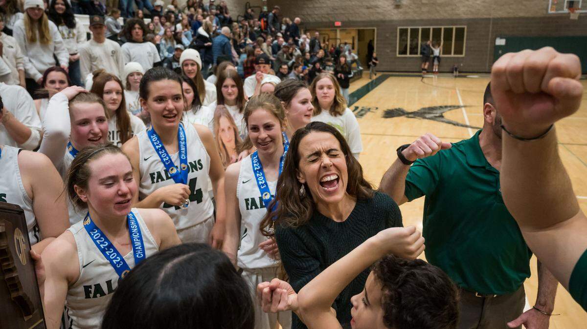 Colfax Falcons head coach Rexanne Simpton, center, lets out a cheer as her players celebrate with fans after their 53-52 victory over the Caruthers (Fresno County) Blue Raiders in the CIF Northern California Division III high school girls basketball championship game Tuesday, March 7, 2023, at Colfax High School.