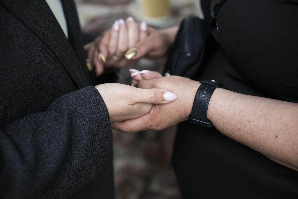 Maria de Jesus Estrada, a DACA recipient that was deported in February to Mexico, prays with Ivonne Rodriguez, press director for FWD.us., before entering the San Ysidro Port of Entry on Monday, March 30, 2026. Estrada was held for five hours.