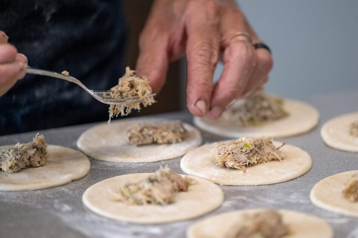 Chef Paul Ladeira fills Portuguese pasteis with rabbit at Blue Ruby Farm in Browns Valley on June 5.