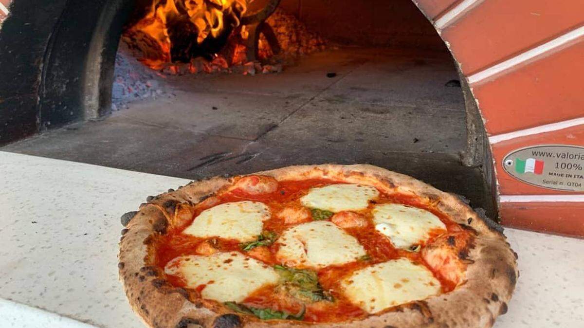 Flour Dust Pizza is family owned. Chef Mano Vrapi studied pizza-making in Florence, Italy.