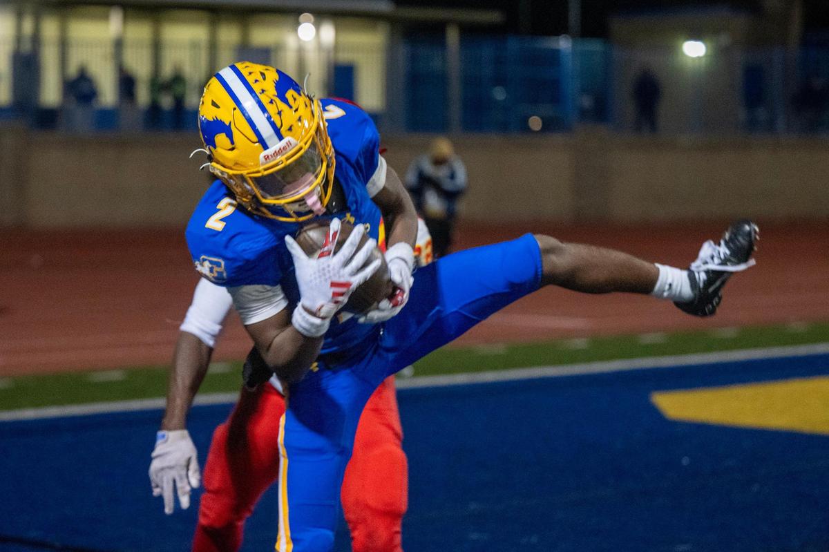 The Grant Pacers’ Koby Shabazz (2) catches a touchdown pass in front of the Jesuit Marauders’ Chris Effiong Jr. (22) in the first half a Sac-Joaquin Section Division II quarterfinal playoff game on Friday, Nov. 15, 2024 in Del Paso Heights.