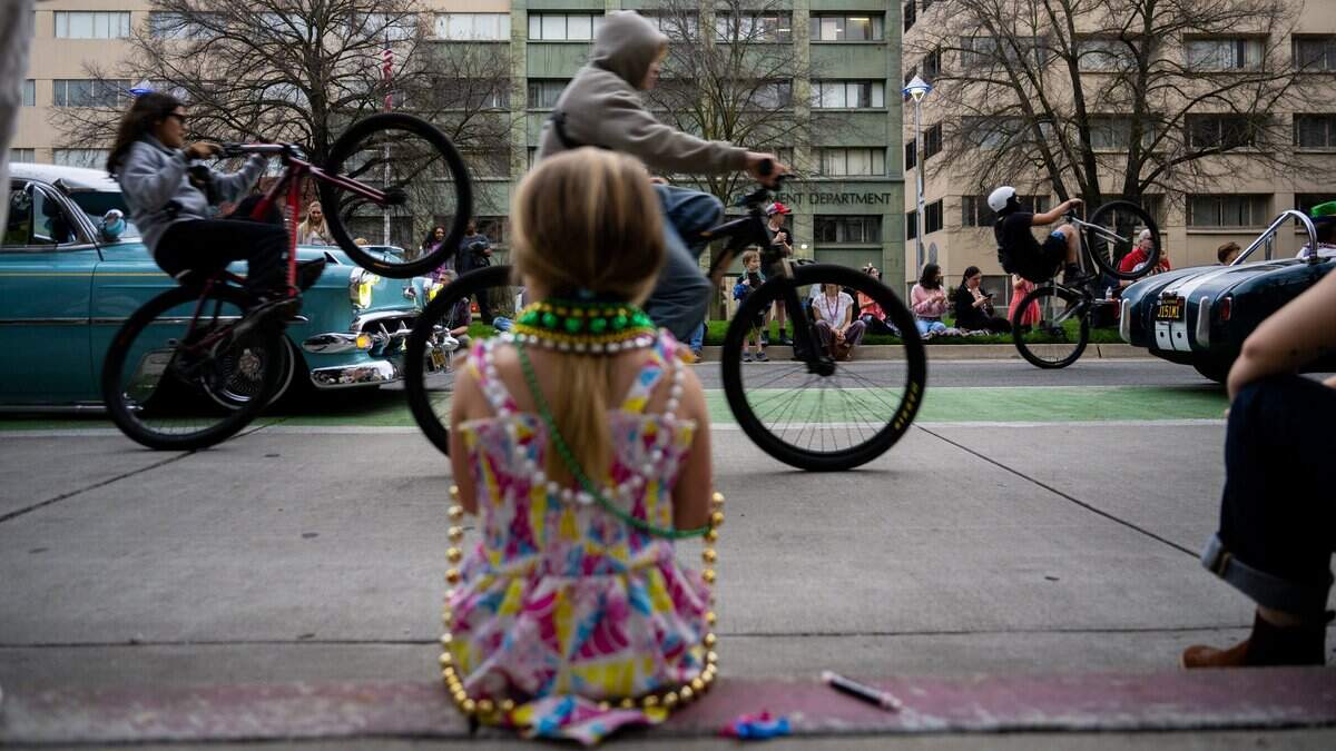 Bicyclists ride down Capitol Mall during the City of Trees Parade on Saturday, Feb. 28, 2026. Sacramento’s regional transportation planning agency hopes to get more people riding bikes.
