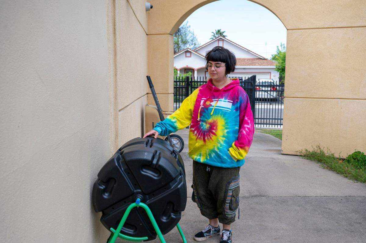 Miranda Navarro, 17, spins a composter the students will use to make soil from food scraps for a student garden they’re making in the fall at New Technology High School in April.