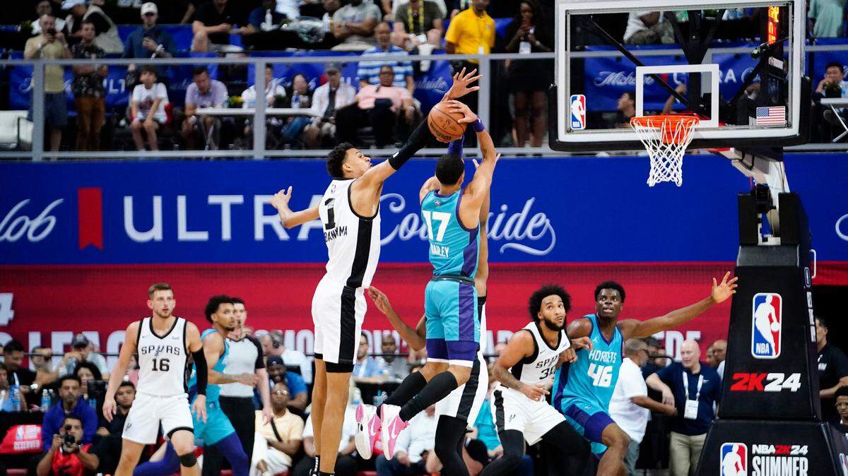 San Antonio Spurs center Victor Wembanyama (1) attempts to block a shot from Charlotte Hornets guard Amari Bailey (17) during the second half July 7, 2023, at Thomas & Mack Center in Las Vegas, Nevada.