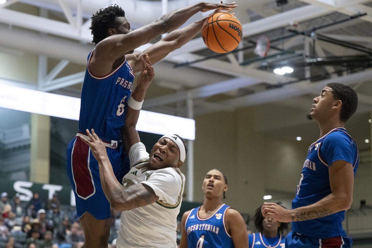 Presbyterian forward Chidi Chiakwelu (6) blocks Sacramento State guard Prophet Johnson (16) from shooting during a game between Sac State and Presbyterian at Hornet Pavilion in Sacramento on Sunday, Nov. 16, 2025.
