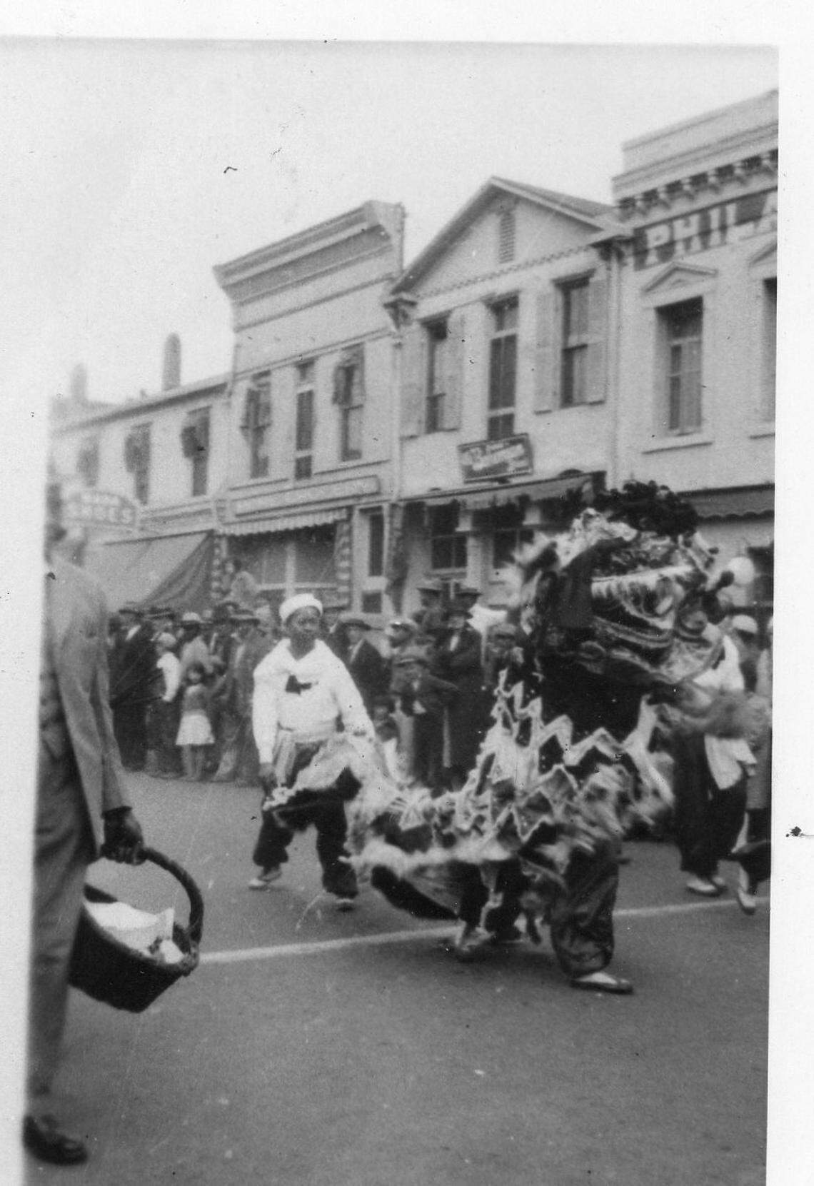 This image taken circa 1930 in Marysville shows Bok Kai parade lion dancers. The lion dancers form a team mimicking motions of a single animal as they move. The dance is traditionally accompanied by gongs, drums and firecrackers, representing the descent of good luck. The parade and celebration have taken place every year, with one exception, since 1880.