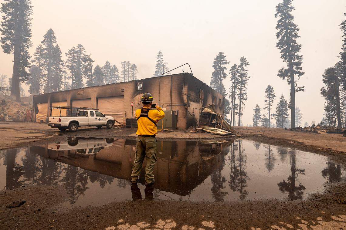 Larry Bopp of AIG surveys damage on Monday, Aug. 30, 2021, to a maintenance building at the Sierra-at-Tahoe ski resort that was destroyed overnight during the Caldor Fire in the Eldorado National Forest.