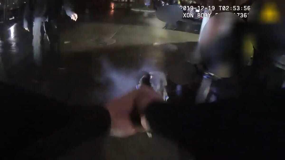 In an image taken from bodycam video, a Sacramento Police officer is seen shooting at a dog as police arrested its owner near the Safeway on the 1800 block of 19th Street in midtown Sacramento on Dec. 18, 2019. The dog was injured but survived, police said, and a security guard and the man detained, Kevin Cole, were hit by shrapnel from the gunshot.
