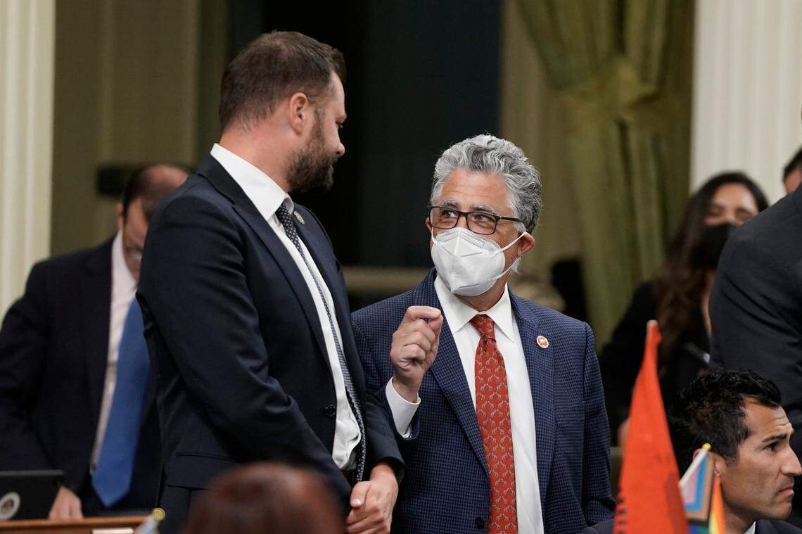 State Sen. Anthony Portantino, D-La Cañada Flintridge, right, talks with Assemblyman Matt Haney, D-San Francisco, during the late night Assembly session in August at the Capitol. Portantino is bringing back a failed bill to replace limits on carrying concealed weapons permits that were struck down by a recent U.S. Supreme Court ruling.