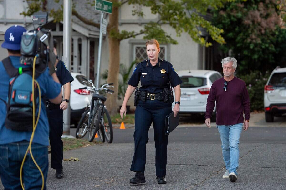 Sacramento Police Chief Kathy Lester walks to the alley entrance of the Sutter Lawn Tennis Club in East Sacramento on Monday, Oct. 24, 2022, for a private community meeting about the fatal shooting near the club last week.