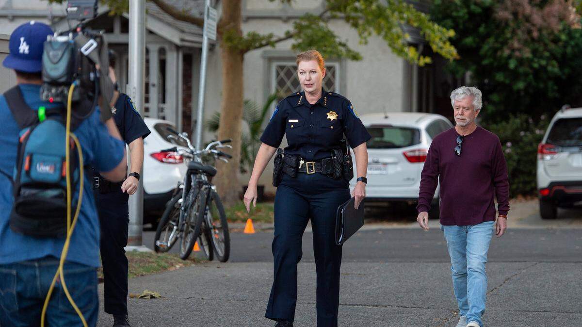 Sacramento Police Chief Kathy Lester walks to the alley entrance of the Sutter Lawn Tennis Club in East Sacramento on Monday, Oct. 24, 2022, for a private community meeting about the fatal shooting near the club last week.