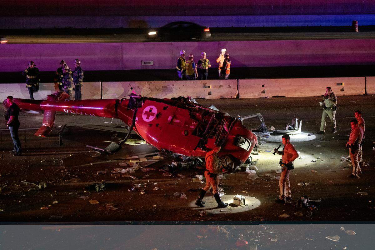A medevac helicopter with three people crashed on eastbound Highway 50 near 44th Street on Monday, Oct. 6, 2025, in Sacramento. The aircraft was split down the middle, exposing its bungled interior, as CHP investigators used flashlights along the shoulder, searching for debris.