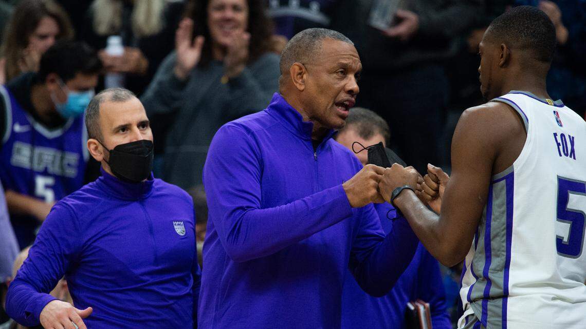 Sacramento Kings interim head coach Alvin Gentry fist bumps Sacramento Kings guard De’Aaron Fox (5) during his first game as interim head coach against the Philadelphia 76ers at Golden 1 Center on Monday, Nov. 22, 2021, in Sacramento.