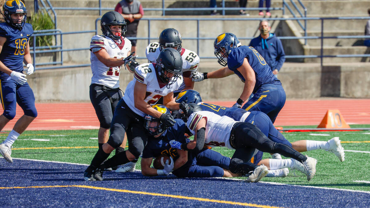 Oak Ridge junior running back Reese Catchings (16) had the Trojans’ lone touchdown of the game in the 10-6 win over Whitney Saturday afternoon in El Dorado Hills.