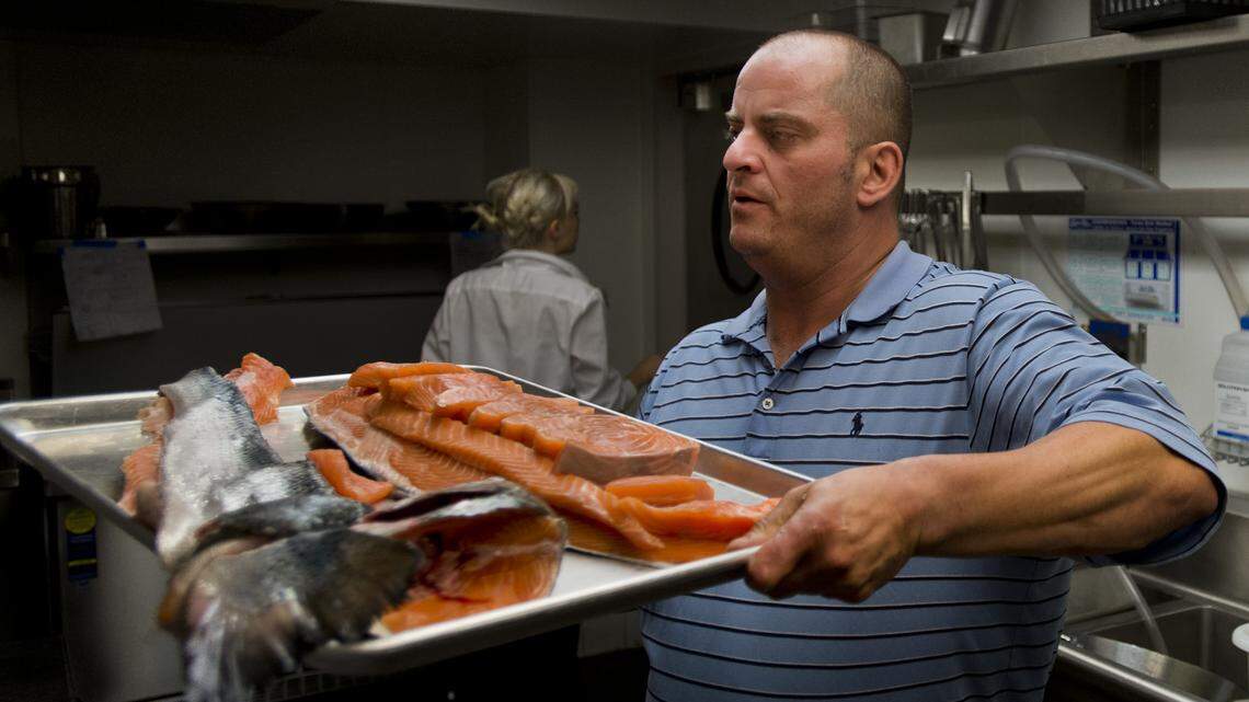 Chef Noah Zonca filets and cuts portions of salmon at Capital Dime in midtown Sacramento in 2013. Zonca died May 4, 2018, according to a memorial page set up on Facebook.