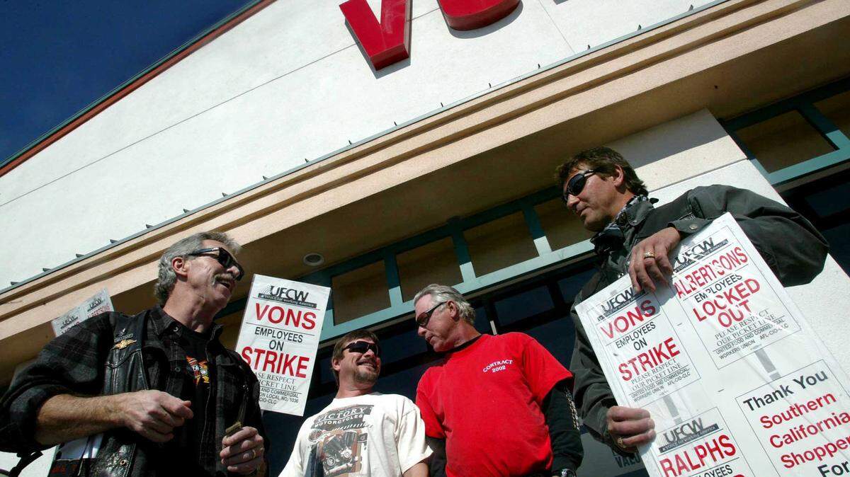 Dwane Moore, John Backman, Derek Moore and Ray MacNeil, left to right, stand outside a Vons supermarket on Stockdale Highway in Bakersfield, Calif., Sunday, Feb. 8, 2004, along with more than 50 Harley Davidson motorcycle riders to show their support for the supermarket strikers who have been on strike for four months against Safeway Inc., Kroger Co. and Albertsons Inc. (AP Photo/The Bakersfield Californian, Jenna Bowles)